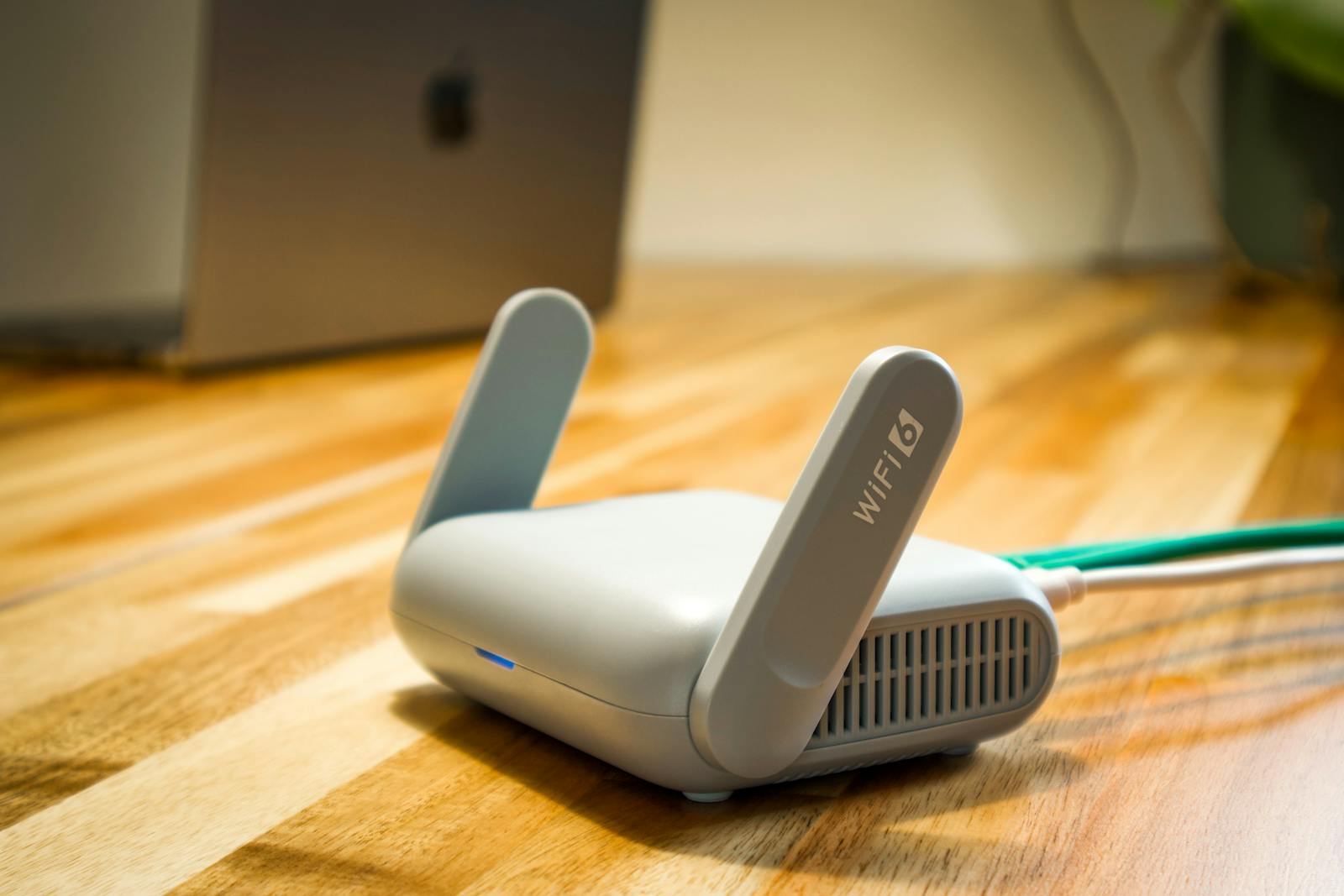 Wi-Fi router with antennas on a wooden table