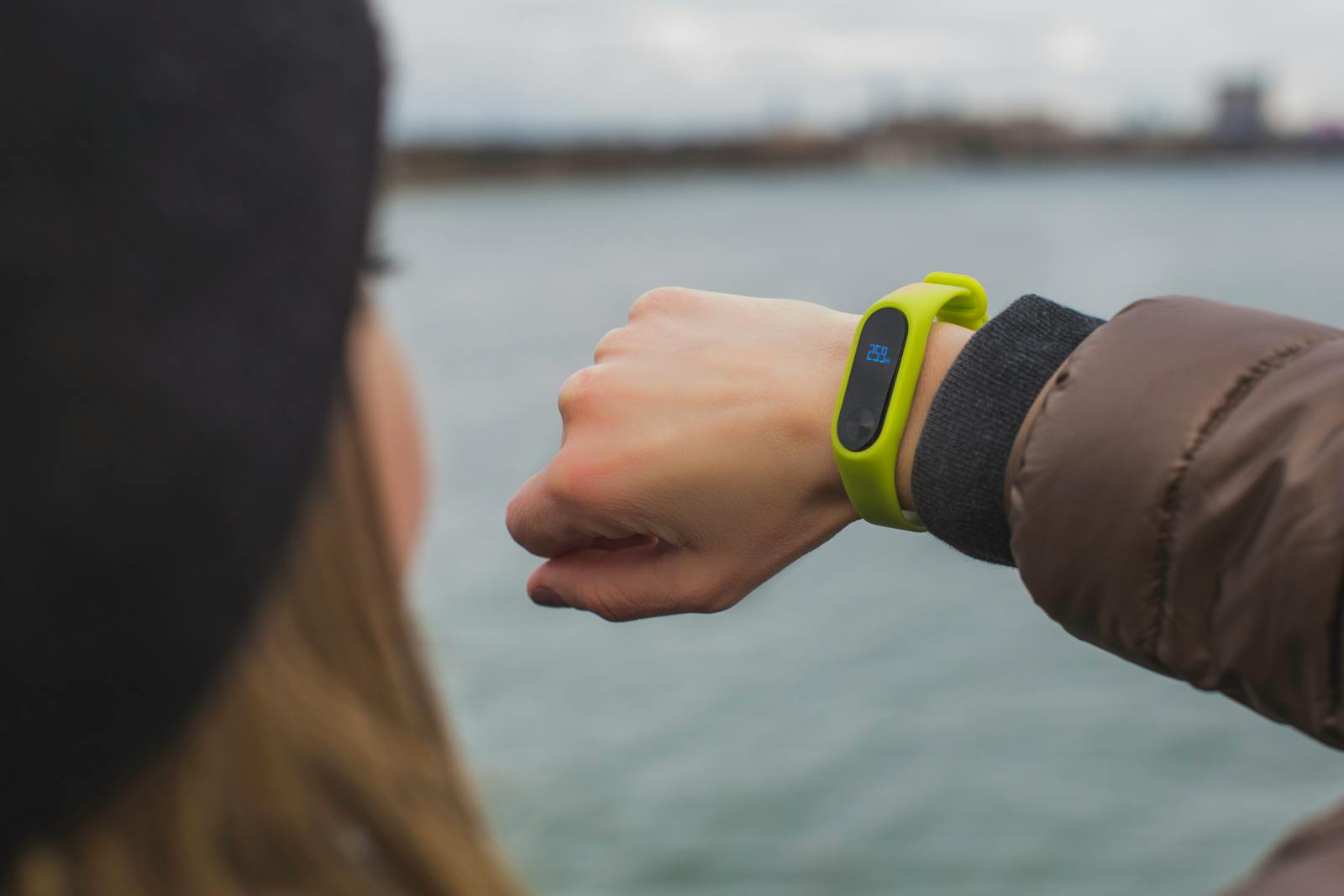 Person checking a smartwatch outdoors